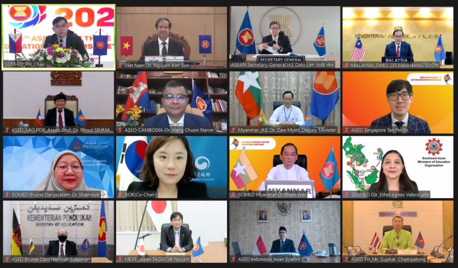 Video conference screen with 16 participants, national flags, and organizational logos.